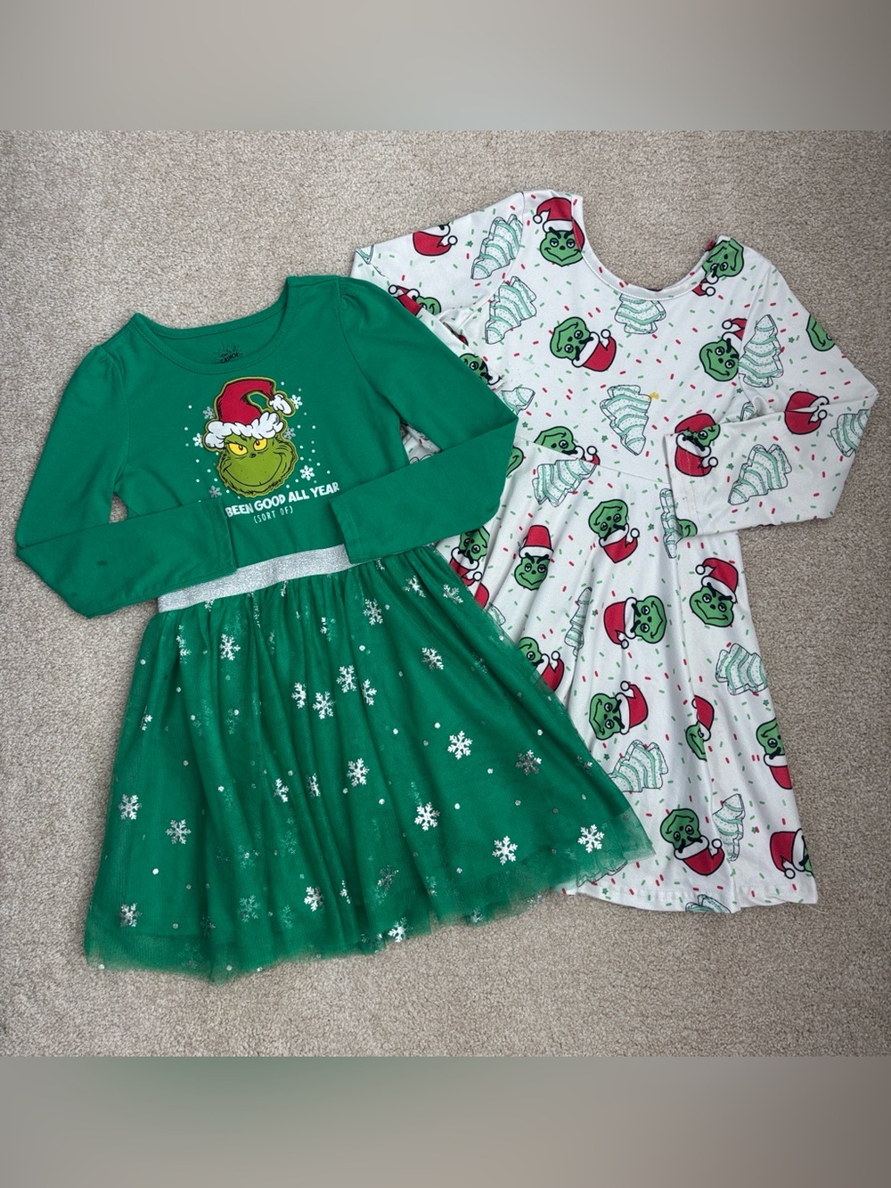 Pair of The Grinch dresses, size 6. Flaws as shown.